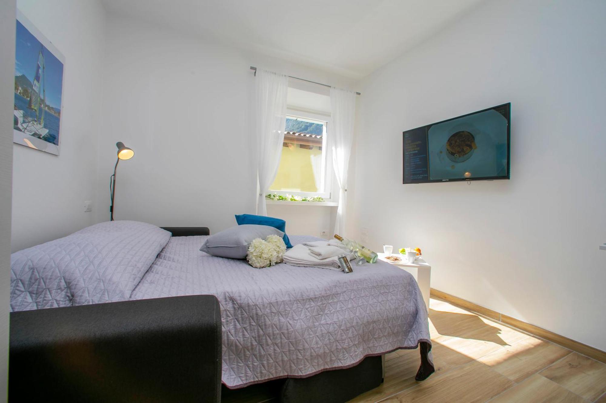 Nido Sui Tetti Di Riva Del Garda - Happy Rentals Екстериор снимка