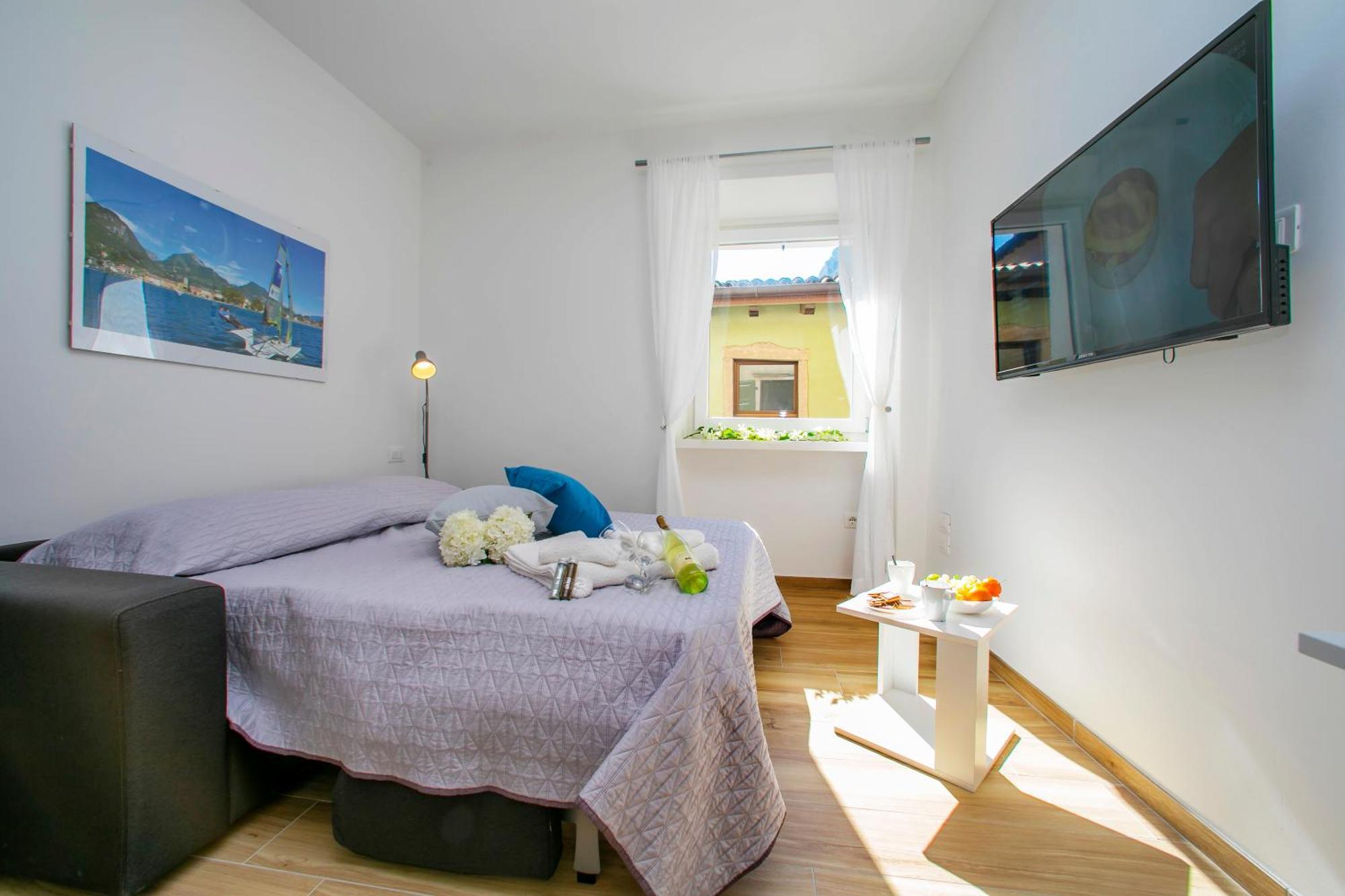 Nido Sui Tetti Di Riva Del Garda - Happy Rentals Екстериор снимка